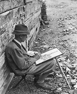 Hobby: Painter painting in the destroyed Munich, 1945