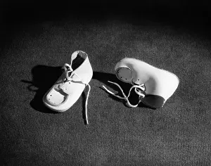 Booties: Pair of Baby Booties in Spotlight One Upright and One On Sid