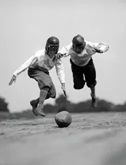 Jocks: Pair of boys in knickers & leather helmets racing