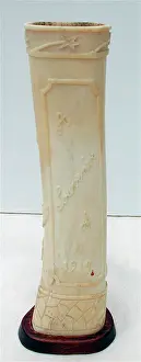 Foliate: Pair of carved bone ornaments with raised foliate decoration