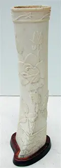 Foliate: Pair of carved bone ornaments with raised foliate decoration
