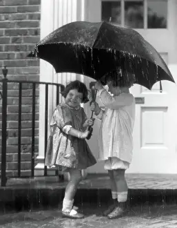 Stoop: Pair of little girls standing on front stoop