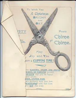 Puns: Pair of scissors with comic verse on a Christmas card