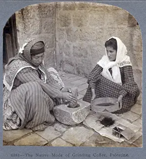 Pestle: Palestine, two women seated, one with mortar ?