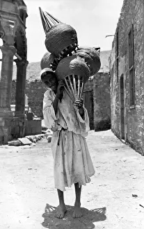 Bamboo: Palestinian man with cotton on the way to customers