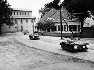 Affiliation: Panzer I pass through a town in the 30s