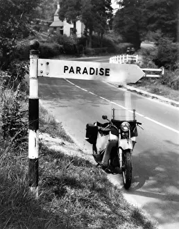 Signposts: PARADISE THIS WAY!