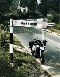 Signposts: PARADISE THIS WAY!