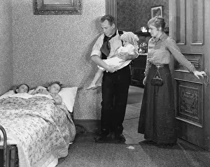 Paternal: Parents with children at bedtime