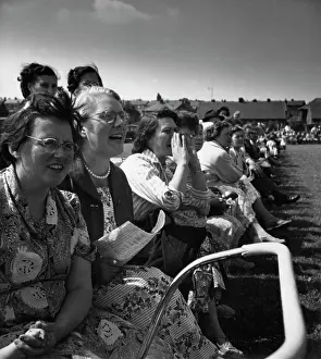 Spectating: Parents spectating at school sporting event