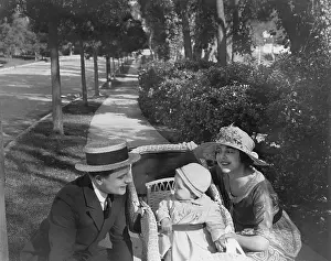 Strollers: Parents on walk with baby