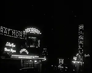 Monico: Paris at Night Lit Up By Lights. Signs read