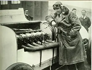 Parry: Parry Thomas, racing driver, inspecting 400 hp engine