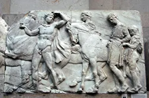 Parthenon: Parthenon. A boy helps a rider to adjust the length of his t