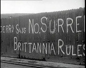 Derry: Partial View of a Spray-Painted Fence, Which
