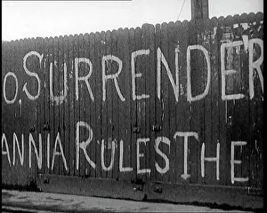 Derry: Partial View of a Spray-Painted Fence, Which