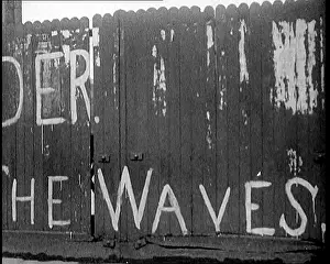 Derry: Partial View of a Spray-Painted Fence, Which