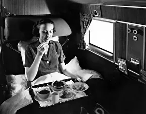 Mainliner: A passenger eats breakfast on United Airline's ?