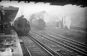 Mogul: Passenger steam train at platform