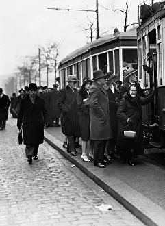 Streetcar: Passengers board a streetcar, 1930