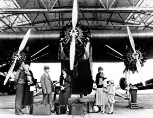 Pelt: Passengers with Ford Trimotor aeroplane