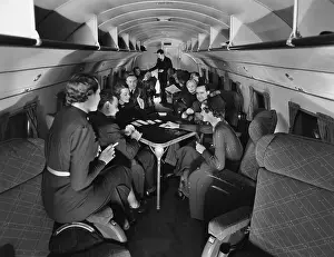 Mainliner: Passengers play cards on United Airline's ?