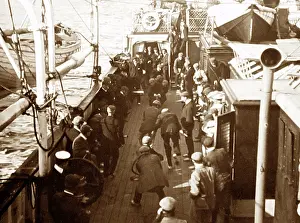 Passengers playing deck games, tug of war, on ship