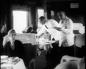 Waited: Passengers Sitting in the Dining Car of a Train