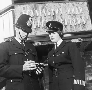 Kennington: PC and WPC outside Kennington Road station