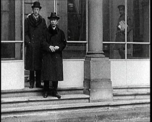 British Pathé Ltd: Peace Delegates Leaving Through A Back Exit