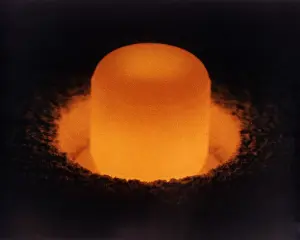 Isotopes: Pellet of Plutonium-238 glowing from its ?