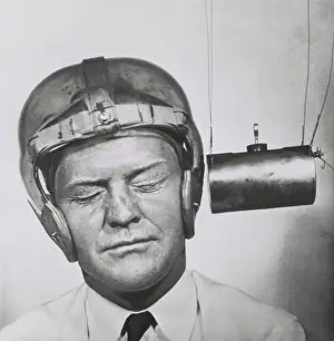 Pounding: Pendulum pounding a plastic helmet worn for testing
