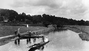 Punting: People boating on a river