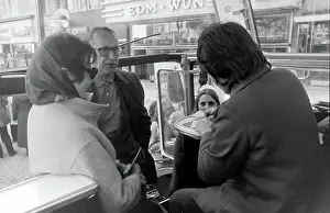 Capitalist: People on a bus, West Berlin, Germany