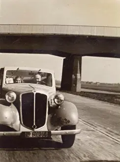 The Kathy Butler Collection: Two people in a car on the Autobahn, Germany