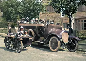People in charabanc and motorcycle sidecar