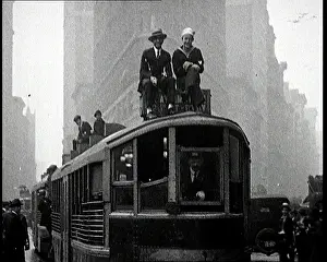 Clinging: People Clinging To the Outside of a Tram During