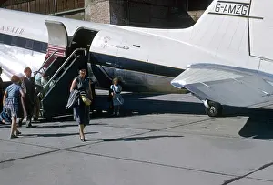 Pioneering: People disembark from a Transair aeroplane