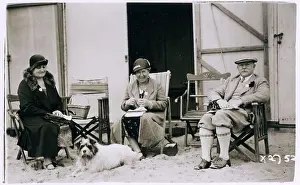 Tweedy: Three people and a dog on the beach