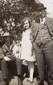 Monday: Three people and a dog in a garden