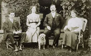 Shaggy: Four people and a dog in a garden