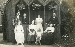 Loggia: Eight people with a dog in a garden