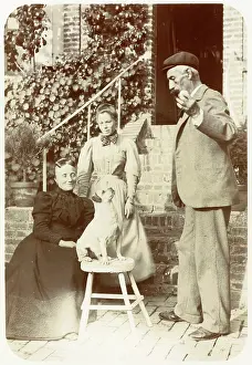 Stool: Three people with a dog in a garden