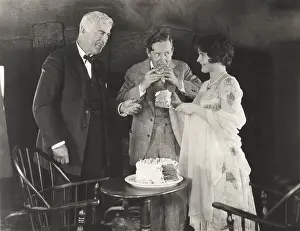 Indulgence: Three people enjoying a slice of cake