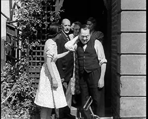 Exiting: People Exiting a House