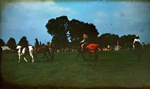 Piebald: People at a fair on horseback
