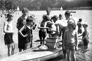 Canoeing: People gathered around a canoe, Germany