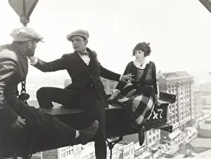 Vertigo: Three people high up on a metal joist
