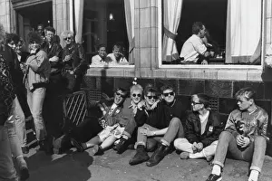 Distinctive: People inside and outside a pub or cafe