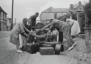Perranporth: People loading a car at Perranporth, Cornwall